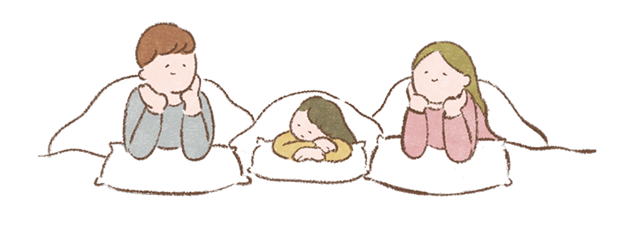 お布団に入る家族